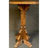 An oak ecclesiastical type stand, adzed throughout, 76cm