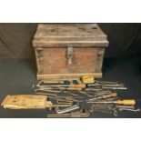 A stained pine tool chest, fitted with drawers, assorted metal and engineering tools, wrenches, etc