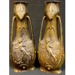 A pair of late 19th century French Art Nouveau cold painted spelter three handled vases, after J