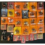 A collection of Del Prado lead figures, various poses, mostly in packets on cardboard backs (