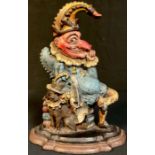 A 19th century cold painted cast iron door stop modelled as Punch with his dog, Toby, 30cm high