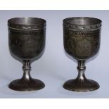 A pair of large Indian bidri pedestal goblets, chased and decorated with mihrab panels, stylised