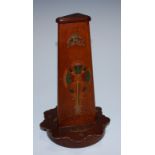 An early 20th century optical kaleidoscope toy, the tapering pyramidical tower enclosing a viewing