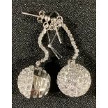 A pair of silver and diamante globular earrings