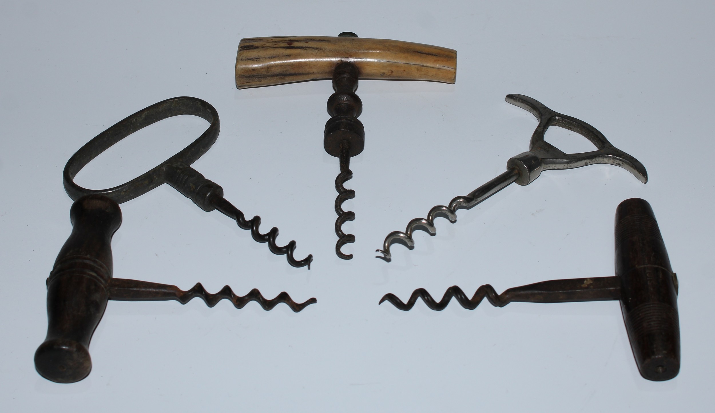 Wine - a 19th century direct-pull corkscrew, stag antler handle, baluster stem, wire helix worm,