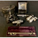 A cased measuring instrument; a camera; two pairs of binoculars; a Rolls Royce tool kit