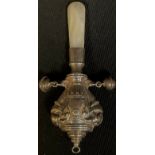 A George V silver novelty baby's rattle, embossed with Indian elephants, mother of pearl haft,