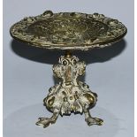 A Renaissance Revival bronze tazza, cast in relief with masksportraits and scrolling motifs,