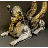 A large hollow resin model of an Egyptian sphinx, approx. 70cm long