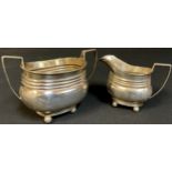 A George V silver sugar bowl, Birmingham 1912, 180g; a George V silver cream jug, Birmingham 1918,
