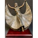 David Smith, a dark patinated reproduction bronzed Art Deco style dancing girl, stepped mahogany