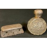 A silver topped cut glass scent bottle, Birmingham 1904; a dressing table box with silver cover,