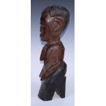 Tribal Art - an African figure, bust-length with eliptical features, V-shaped base, 47cm high