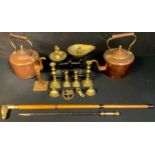 A Victorian copper kettle, acorn finial; a copper kettle; a set of balance scales with graduated