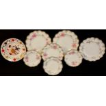 A set of five Royal Crown Derby Pinxton Roses shaped circular plates; a set of two graduated