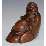 A Chinese bamboo carving, of Budai, seated, smiling, 20cm high