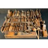 Carpentry Tools - a quantity of 19th century and later wooden moulding planes, various sizes,