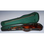 Musical Instruments - a violin, 35.9cm two-piece back excluding button, outlined throughout with