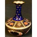 A Royal Crown Derby Imari 1128 pattern bottle vase, 11cm, printed marks, year cypher for 1910