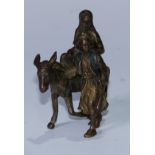 An Austrian cold painted bronze, cast in the Orientalist taste as an Arab leading a donkey, his wife
