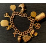 A 9ct rose gold double curb link charm bracelet, suspended with assorted charms including poodle,