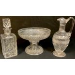 A Victorian cut glass claret jug; a cut glass comport; a cut glass decanter (3)