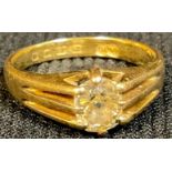 An 18ct gold diamond solitaire gypsy ring, oval cut, slight citrus tinge, approx 0.5ct, size O/P, 5g