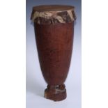 Tribal Art - An African drum, hide skin, pierced carrying loop, geometric socle, 42cm high, possibly