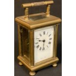 An late 19th/early 20th century French brass carriage timepiece, Roman numerals on white enamel