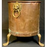 A riveted copper log bin, three paw feet, lion mask handles, 39cm high