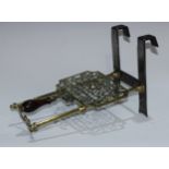 Masonic and Friendly Society Interest - a 19th century brass and steel trivet, the adjustable