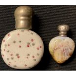 A porcelain heart shaped scent bottle with silver top, London 1903; another (2)