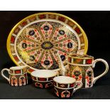 A Royal Crown Derby Imari palette 1128 pattern miniature tea set on tray, comprising teapot, milk