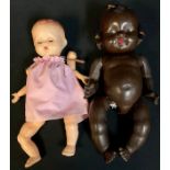 A celluloid baby doll; a composite baby doll (2)