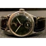 A vintage Omega black faced military wristwatch