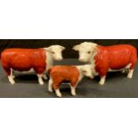 A Beswick model of a Hereford Bull Ch. Of Champions, Hereford Cow Ch. of Champions and a Hereford