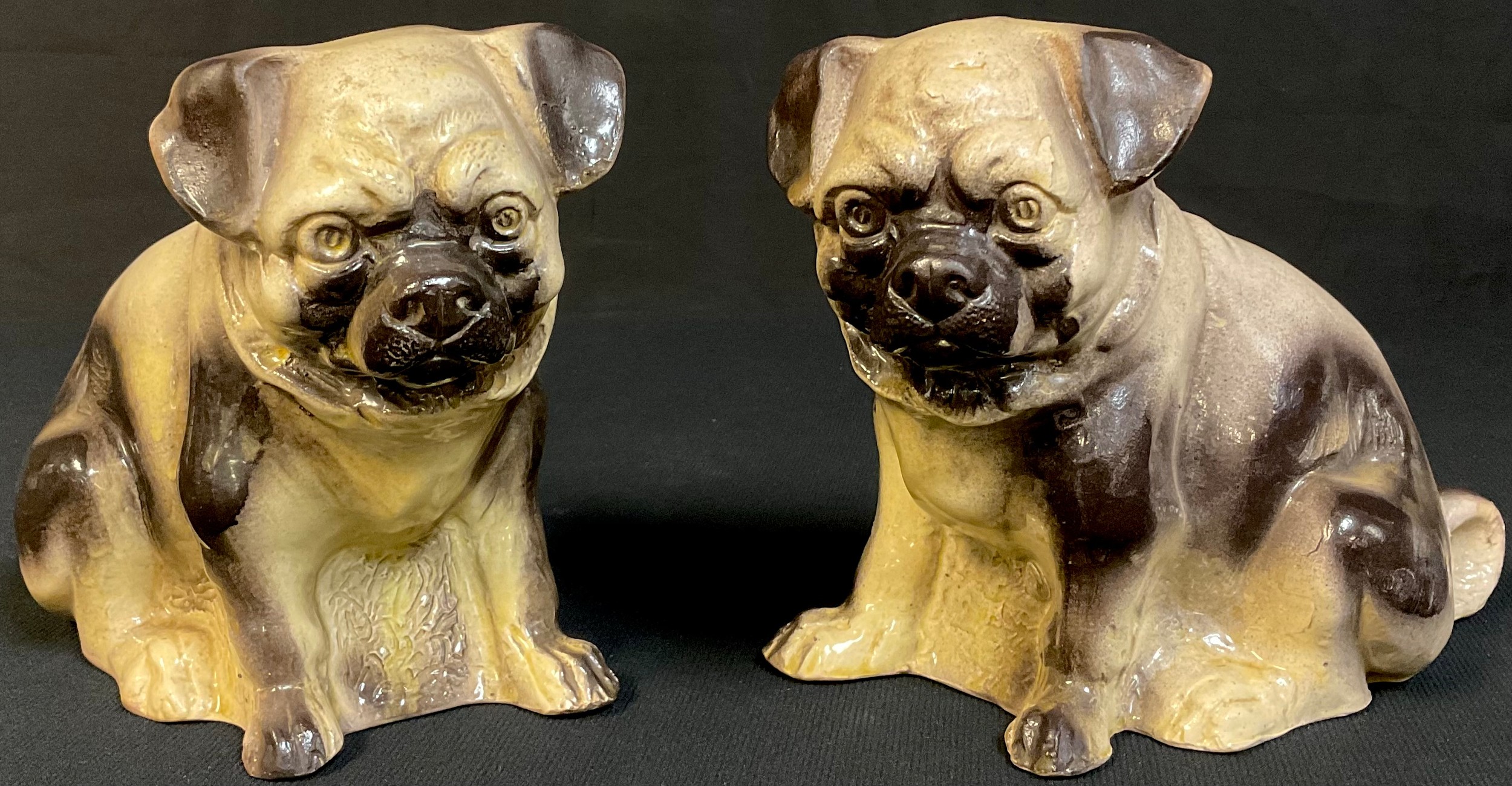 A pair of late 19th century stoneware mantel pugs, 16cm