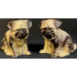 A pair of late 19th century stoneware mantel pugs, 16cm