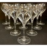 A set of ten white wine glasses