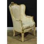 A French Louis XV Revival painted softwood fauteuil à oreilles, the shaped cresting carved with