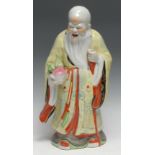 A large Chinese porcelain figure, of Shou Lao, he stands, holding a peach, 41cm high, impressed