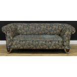 An Edwardian country house Chesterfield single drop-arm club sofa, 70.5cm high, 180cm wide, the seat