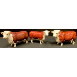 A Beswick model of a Hereford Bull Ch. Of Champions; another; a model of a Hereford Cow Ch. Of