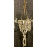 A late 19th/early 20th century cut glass purse shaped ceiling light, with cut glass lustre droplets,