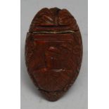 A 19th century French coquilla nut snuff box, the cover carved in relief with a bust-length