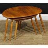 An Ercol elm and beech pebble-form nest of three occasional tables, the largest 39.5cm high, 64.