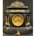 A late 19th century French black slate mantel clock, brass mounted arched case, pierced brass dial