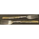 Japanese Arms and Armour - a pair of silver table forks, the parcel-gilt bronze handles formed