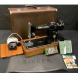 A Singer sewing machine, faux crocodile skin carry case