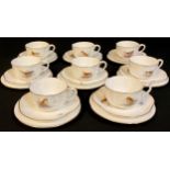 A Royal Worcester coffee set for eight, painted with garden birds, comprising eight cups, saucers